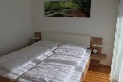 Ein Bett oder Betten in einem Zimmer der Unterkunft Familienapartment Sunnseitn