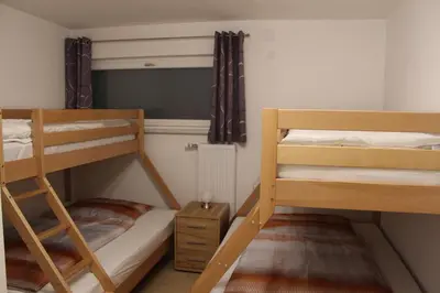 Ein Bett oder Betten in einem Zimmer der Unterkunft Familienapartment Sunnseitn