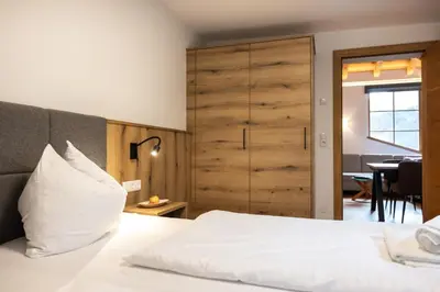 Ein Bett oder Betten in einem Zimmer der Unterkunft Der Lammhof - Appartements Kaswurm