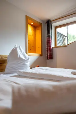 Ein Bett oder Betten in einem Zimmer der Unterkunft Der Lammhof - Appartements Kaswurm