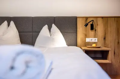 Ein Bett oder Betten in einem Zimmer der Unterkunft Der Lammhof - Appartements Kaswurm