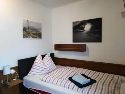Ein Bett oder Betten in einem Zimmer der Unterkunft Privatzimmervermietung Wiederkehr