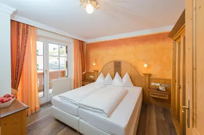 Ein Bett oder Betten in einem Zimmer der Unterkunft Apparthotel Sankt Georg