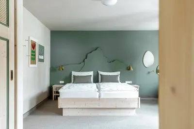 Ein Bett oder Betten in einem Zimmer der Unterkunft Apparthotel Sankt Georg