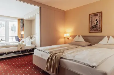 Ein Bett oder Betten in einem Zimmer der Unterkunft Hotel Römerhof Superior