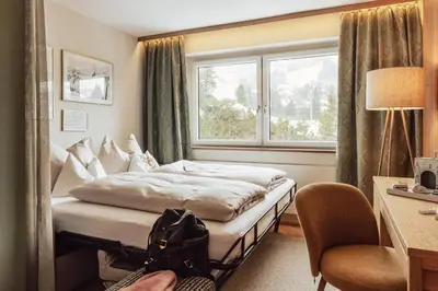 Ein Bett oder Betten in einem Zimmer der Unterkunft Hotel Römerhof Superior