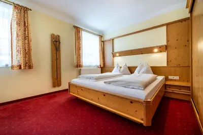 Ein Bett oder Betten in einem Zimmer der Unterkunft Hotel Breitlehenalm