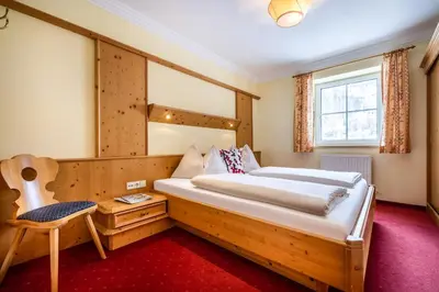 Ein Bett oder Betten in einem Zimmer der Unterkunft Hotel Breitlehenalm