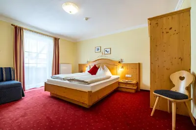 Ein Bett oder Betten in einem Zimmer der Unterkunft Hotel Breitlehenalm