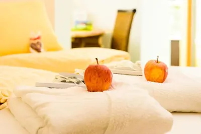 Ein Bett oder Betten in einem Zimmer der Unterkunft Hartweger's Hotel