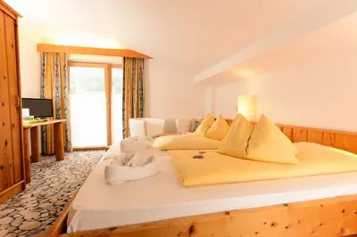 Ein Bett oder Betten in einem Zimmer der Unterkunft Hartweger's Hotel