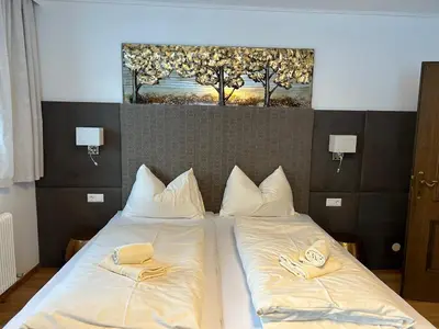 Ein Bett oder Betten in einem Zimmer der Unterkunft Pension Gruber