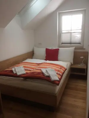 Ein Bett oder Betten in einem Zimmer der Unterkunft Ferienhaus Wind