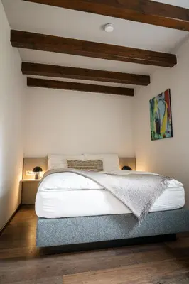 Ein Bett oder Betten in einem Zimmer der Unterkunft Exklusive Seeappartements beim Elfenhaus