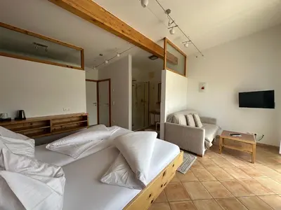 Ein Bett oder Betten in einem Zimmer der Unterkunft MAYER - Wirtshaus und Dorfhotel