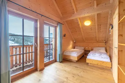 Ein Bett oder Betten in einem Zimmer der Unterkunft Veselý Svišť Chalet Lachtal