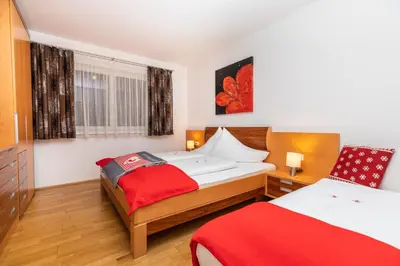 Ein Bett oder Betten in einem Zimmer der Unterkunft EnjoyTheAlps - SKI in-SKI out