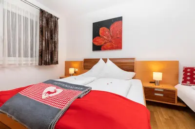 Ein Bett oder Betten in einem Zimmer der Unterkunft EnjoyTheAlps - SKI in-SKI out