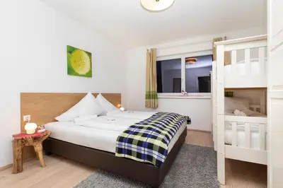 Ein Bett oder Betten in einem Zimmer der Unterkunft EnjoyTheAlps - SKI in-SKI out