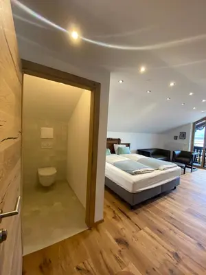 Ein Bett oder Betten in einem Zimmer der Unterkunft Schwarzes Rössl