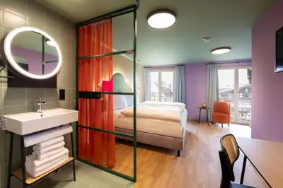 Ein Bett oder Betten in einem Zimmer der Unterkunft Schwarzes Rössl