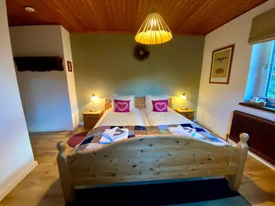 Ein Bett oder Betten in einem Zimmer der Unterkunft Landhaus Fay B&B