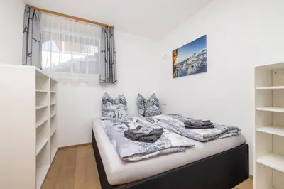 Ein Bett oder Betten in einem Zimmer der Unterkunft Fischis Alpen Appartements