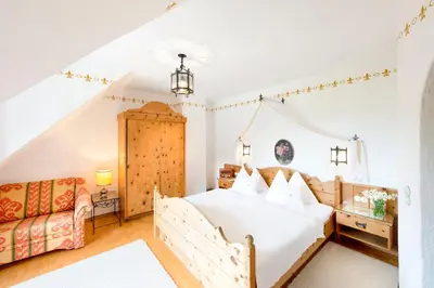 Ein Bett oder Betten in einem Zimmer der Unterkunft Aparthotel Schloss Thannegg