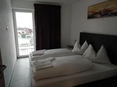 Ein Bett oder Betten in einem Zimmer der Unterkunft Hotel Restaurant Sailer