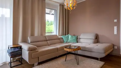 Ein Sitzbereich in der Unterkunft Grimming Lodge by keyone