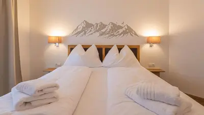 Ein Bett oder Betten in einem Zimmer der Unterkunft Grimming Lodge by keyone