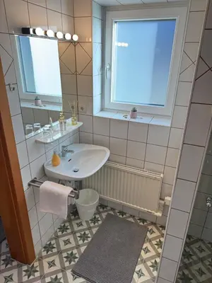 Ein Badezimmer in der Unterkunft Ferienwohnung Saunahaus