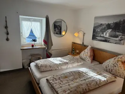 Ein Bett oder Betten in einem Zimmer der Unterkunft Ferienwohnung Saunahaus