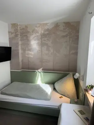 Ein Bett oder Betten in einem Zimmer der Unterkunft Ferienwohnung Saunahaus