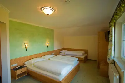 Ein Bett oder Betten in einem Zimmer der Unterkunft Pension Oberhorner