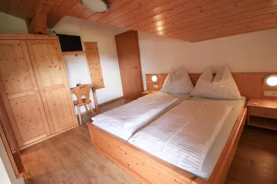 Ein Bett oder Betten in einem Zimmer der Unterkunft Apartements Richlegghof
