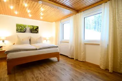 Ein Bett oder Betten in einem Zimmer der Unterkunft Apartmenthaus Vergissmeinnicht