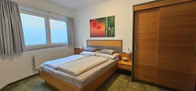 Ein Bett oder Betten in einem Zimmer der Unterkunft Maisonette Haus Amade