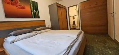 Ein Bett oder Betten in einem Zimmer der Unterkunft Maisonette Haus Amade