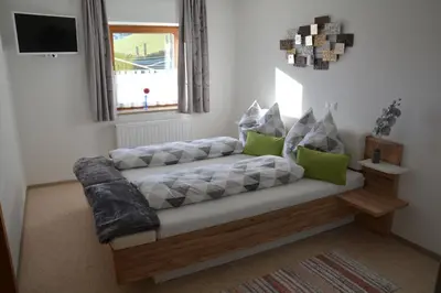 Ein Bett oder Betten in einem Zimmer der Unterkunft Unterbleiwanghof