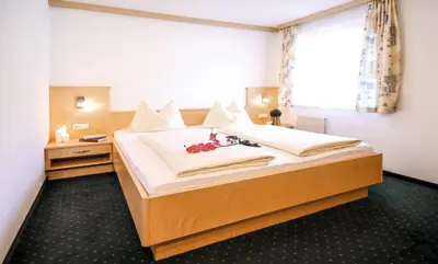 Ein Bett oder Betten in einem Zimmer der Unterkunft Holzmannhof