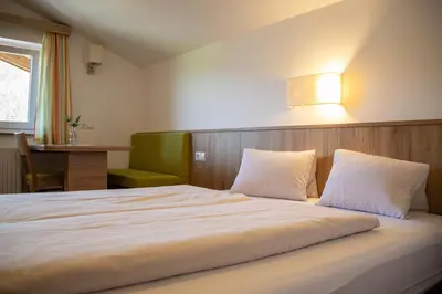 Ein Bett oder Betten in einem Zimmer der Unterkunft Holzmannhof
