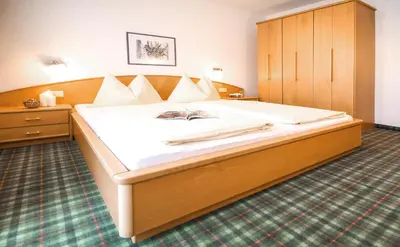 Ein Bett oder Betten in einem Zimmer der Unterkunft Holzmannhof