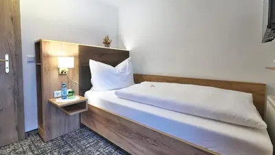 Ein Bett oder Betten in einem Zimmer der Unterkunft Pension Wolfgangsee