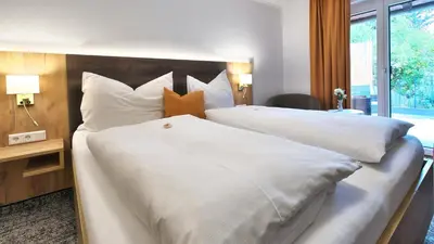 Ein Bett oder Betten in einem Zimmer der Unterkunft Pension Wolfgangsee