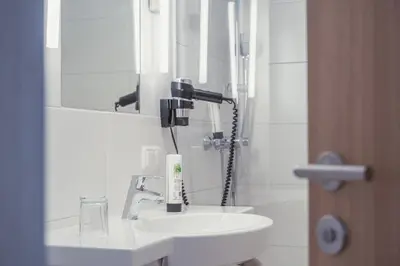 Ein Badezimmer in der Unterkunft Hotel Kendler