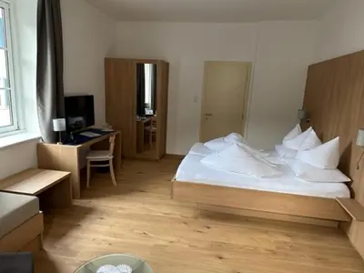 Ein Bett oder Betten in einem Zimmer der Unterkunft Hotel Kendler