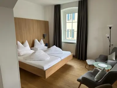 Ein Bett oder Betten in einem Zimmer der Unterkunft Hotel Kendler