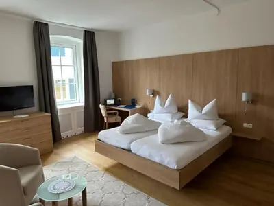 Ein Bett oder Betten in einem Zimmer der Unterkunft Hotel Kendler