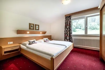 Ein Bett oder Betten in einem Zimmer der Unterkunft Das Filzmoos